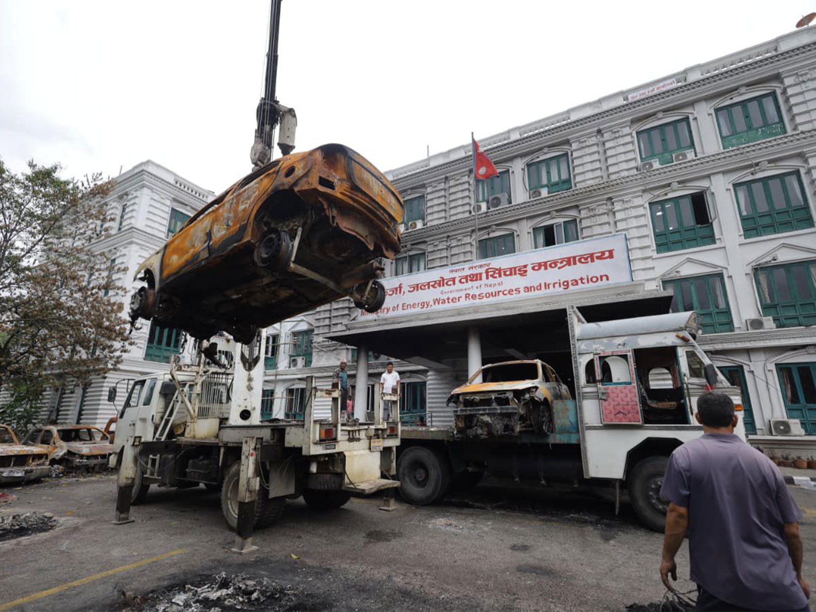 Nepal starts clearing charred vehicles, government buildings (Photo/ANI) Nepal starts clearing charred vehicles, government buildings (Photo/ANI)