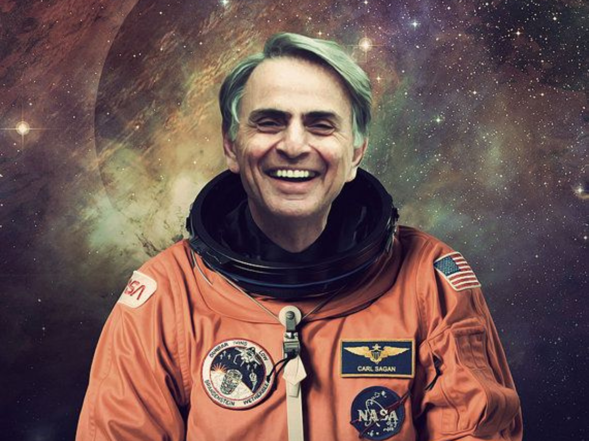 Astronomer Carl Sagan standing beside a telescope, inspiring space exploration. - Photo Gallery