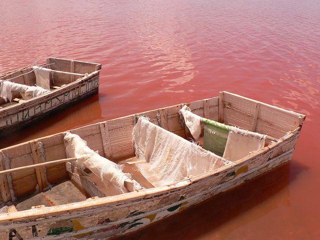 Pink waters of Lake Retba (Lac Rose) with salt workers in Senegal. - Photo Gallery