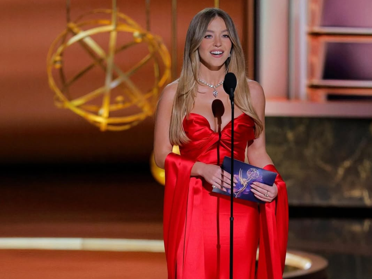 Sydney Sweeney in a strapless red dress with a short train at the 2025 Emmys. - Photo Gallery