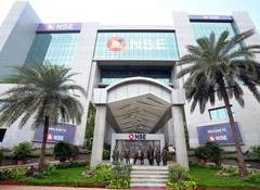 Markets close lower despite FII tax relief ordinance; RBI outlook weighs