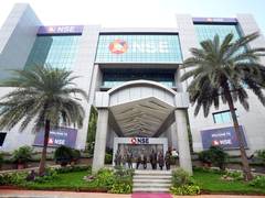 Markets close lower despite FII tax relief ordinance; RBI outlook weighs