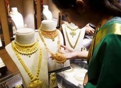 Gold prices may remain under pressure over next month amid global cues: Analysts