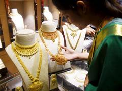 Gold prices may remain under pressure over next month amid global cues: Analysts