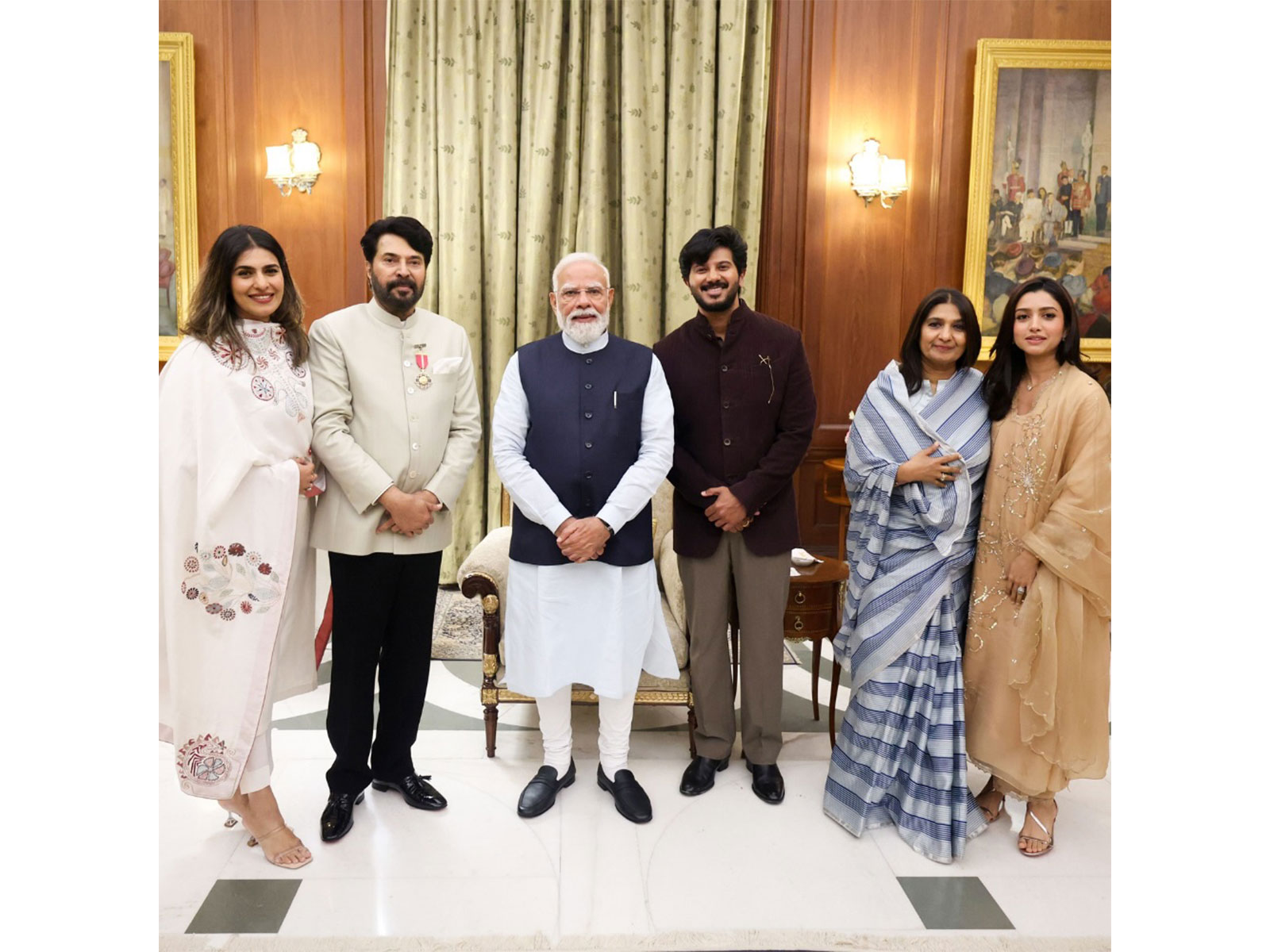 PM Modi with veteran actor Mammootty and his family members (Image source: PM Modi's Instagram)