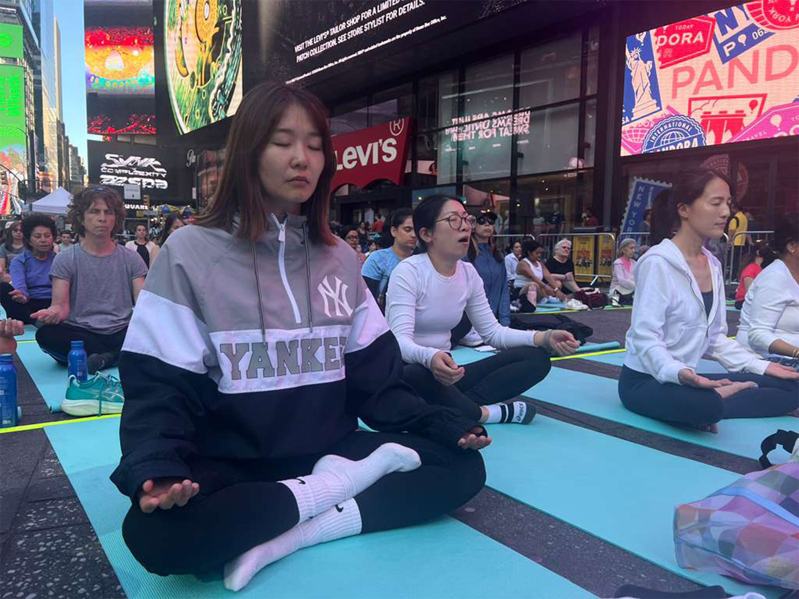 Om chants echo across Times Square in New York on International Yoga Da (Photo/ANI) Om chants echo across Times Square in New York on International Yoga Da (Photo/ANI)