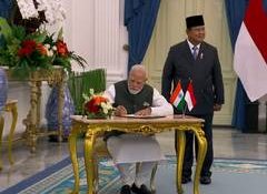 PM Modi signs guestbook upon meeting Indonesian President Prabowo Subianto
