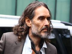 Comedian Russell Brand denies rape charges as he takes stand during trial
